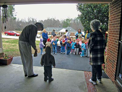 Young neighbors bring gift of Christmas song and joy